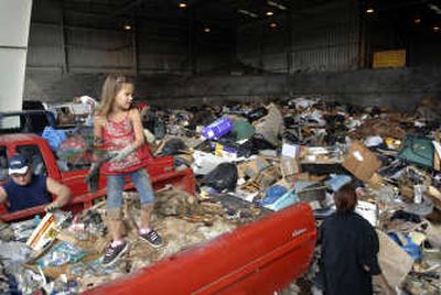 
ack Main hauls prunings from his mulberry tree into a yard waste pile.
 (Photos by HOLLY PICKETT / The Spokesman-Review)