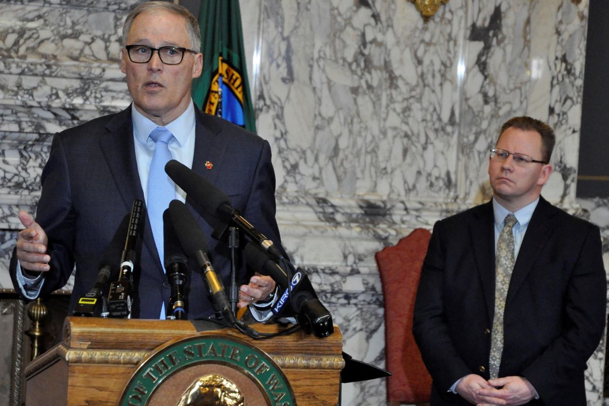 Gov. Jay Inslee, flanked by Superintendent of Public Instruction Chris Reykdal, announces a six-week closure of all Washington schools on March 13.On April 6, they extended that closure through the rest of this school year. (Jim Camden / The Spokesman-Review)