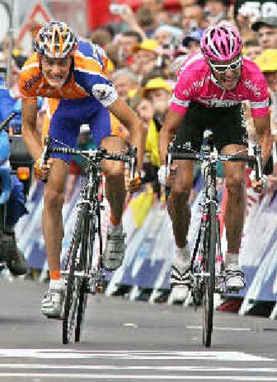 
Pieter Weening of The Netherlands, left, edges Germany's Andreas Kloden to win 8th stage.
 (Associated Press / The Spokesman-Review)