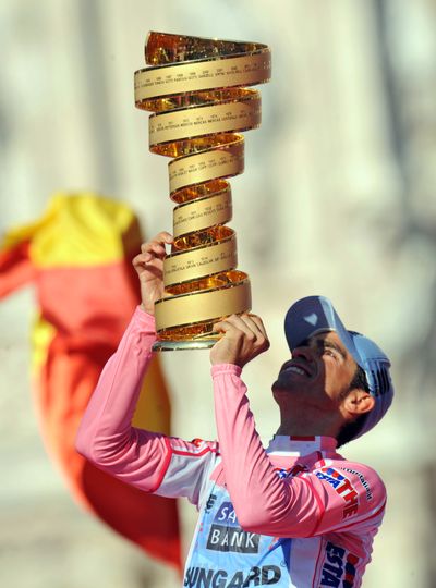 Spain's Alberto Contador lifts the trophy after winning the 94th edition of the Giro d'Italia cycling race in Milan, Italy. (Associated Press)