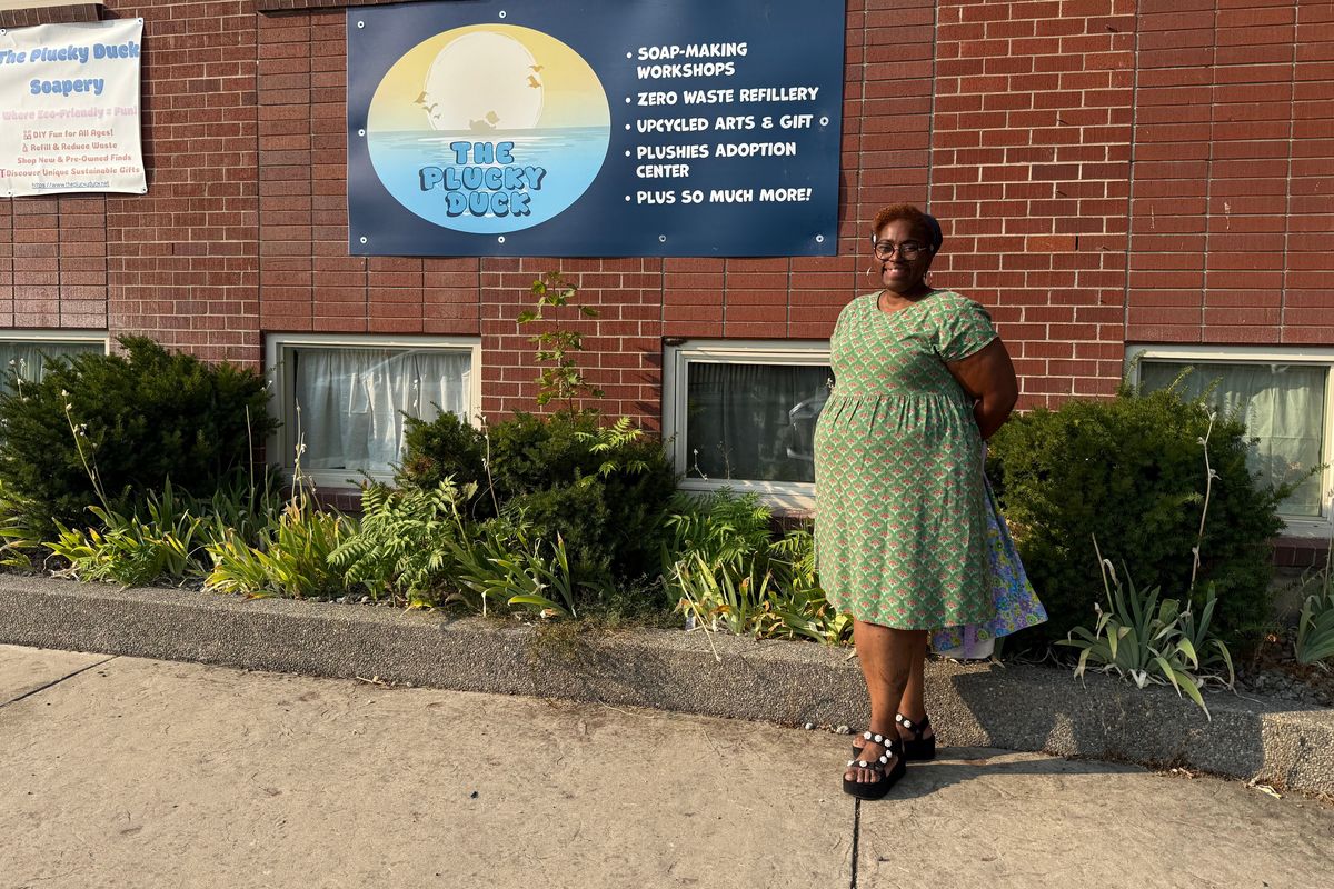 Cristina Aranda stands outside her business, The Plucky Duck.  (April Eberhardt/The Black Lens)