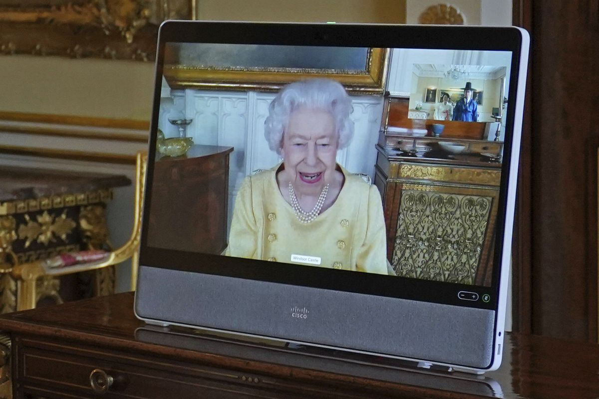 Queen Elizabeth II appears on a screen via videolink from Windsor Castle, where she is in residence, during a virtual audience at Buckingham Palace, London, Tuesday, Oct. 26, 2021.  (Victoria Jones)