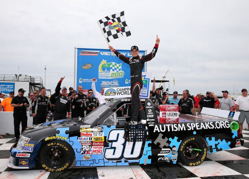 Kyle Larson, driver of the #30 Autism Speaks Chevrolet, celebrates after winning the NASCAR Camping World Truck Series Carolina 200 at Rockingham Speedway on April 14, 2013 in Rockingham, North Carolina. (Photo Credit: Streeter Lecka/Getty Images for NASCAR) (Streeter Lecka / Getty Images North America)
