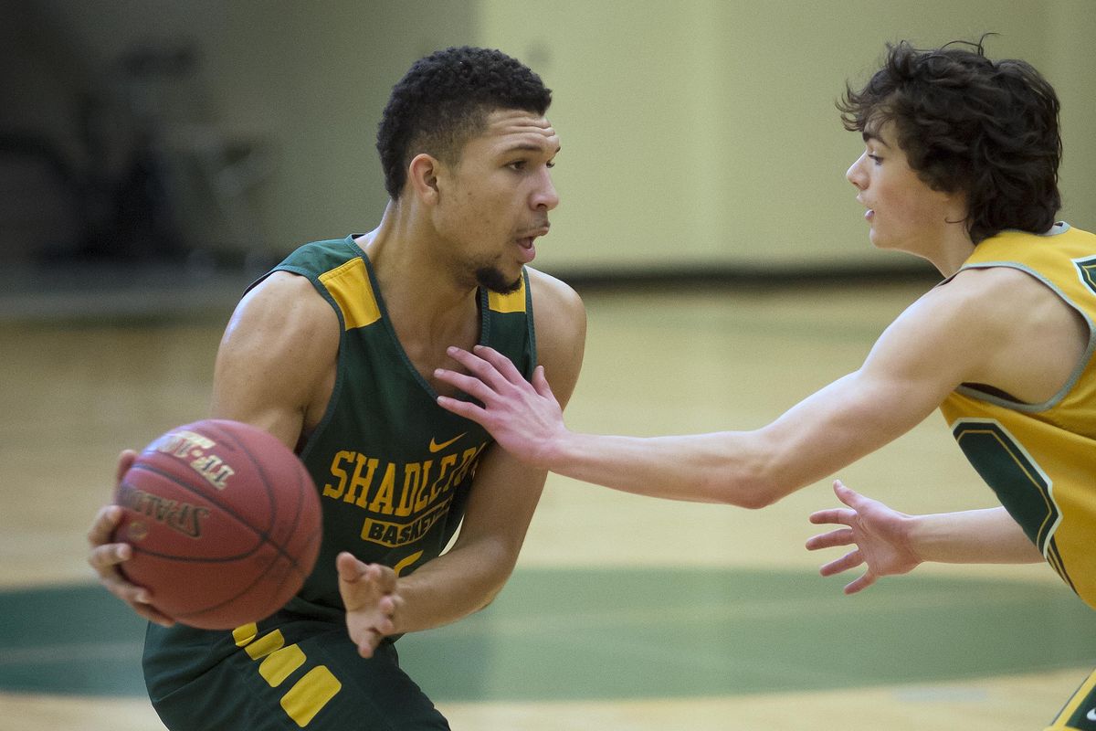 Andreas Brown, left, has proven he can play all five positions on the basketball court for Shadle Park. (Colin Mulvany / The Spokesman-Review)