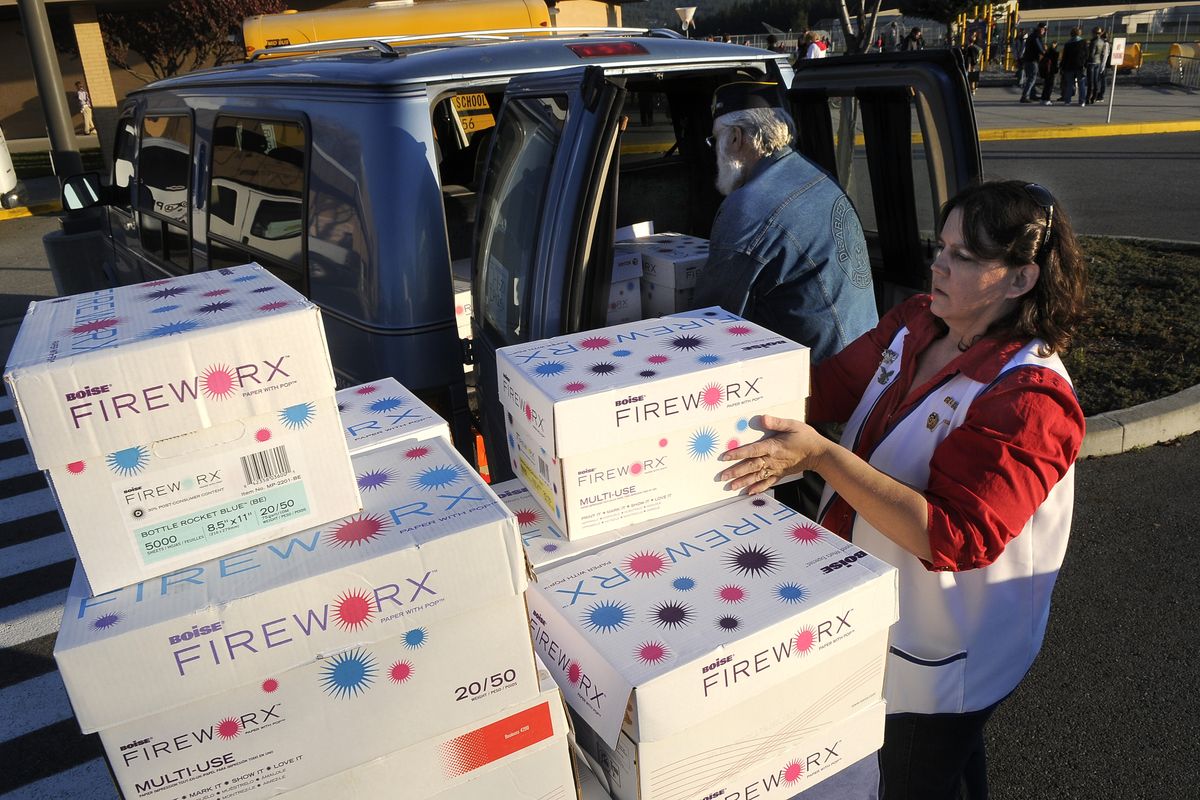 Michelle and Michael Madonna load care packages gathered by Chester Elementary School students Nov. 10, 2010. The kids were able to collect the items in just over a week and the boxes will be sent to troops fighting in the Mideast. (Dan Pelle / The Spokesman-Review)