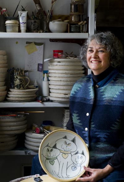 Donna Kulibert poses for a photo on Tuesday at her home studio in Medical Lake. (Tyler Tjomsland)