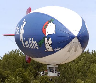 The MetLife Snoopy Two blimp comes in for a landing at the Park Township Airport in Holland, Mich., in this 2007 file photo. (Cory Olsen / Associated Press)
