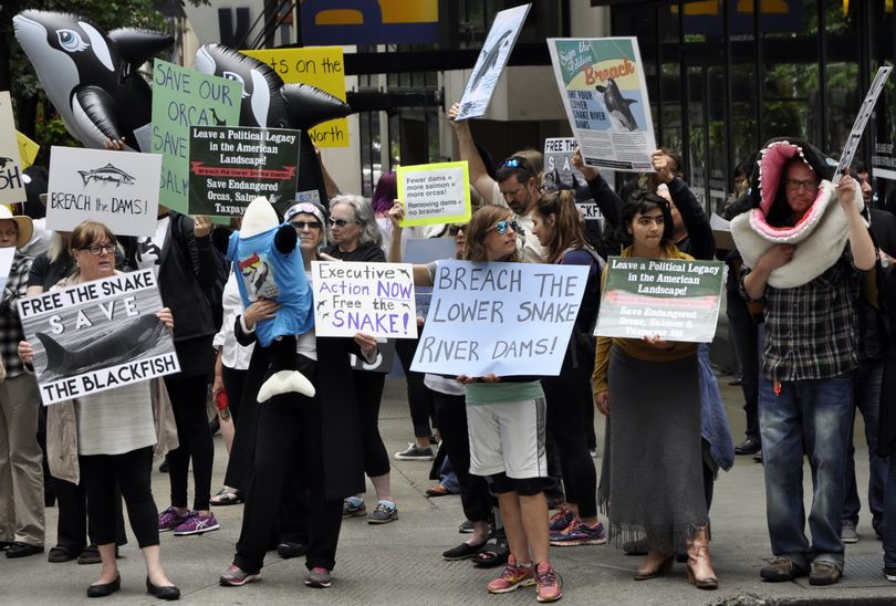 SEATTLE -- Environmental activists calling for the removal of Snake River dams gather on a Seattle street corner on June 24, 2016 near the Washington State Convention Center where President Barack Obama was scheduled to speak later in the day. (Jim Camden/The Spokesman-Review)