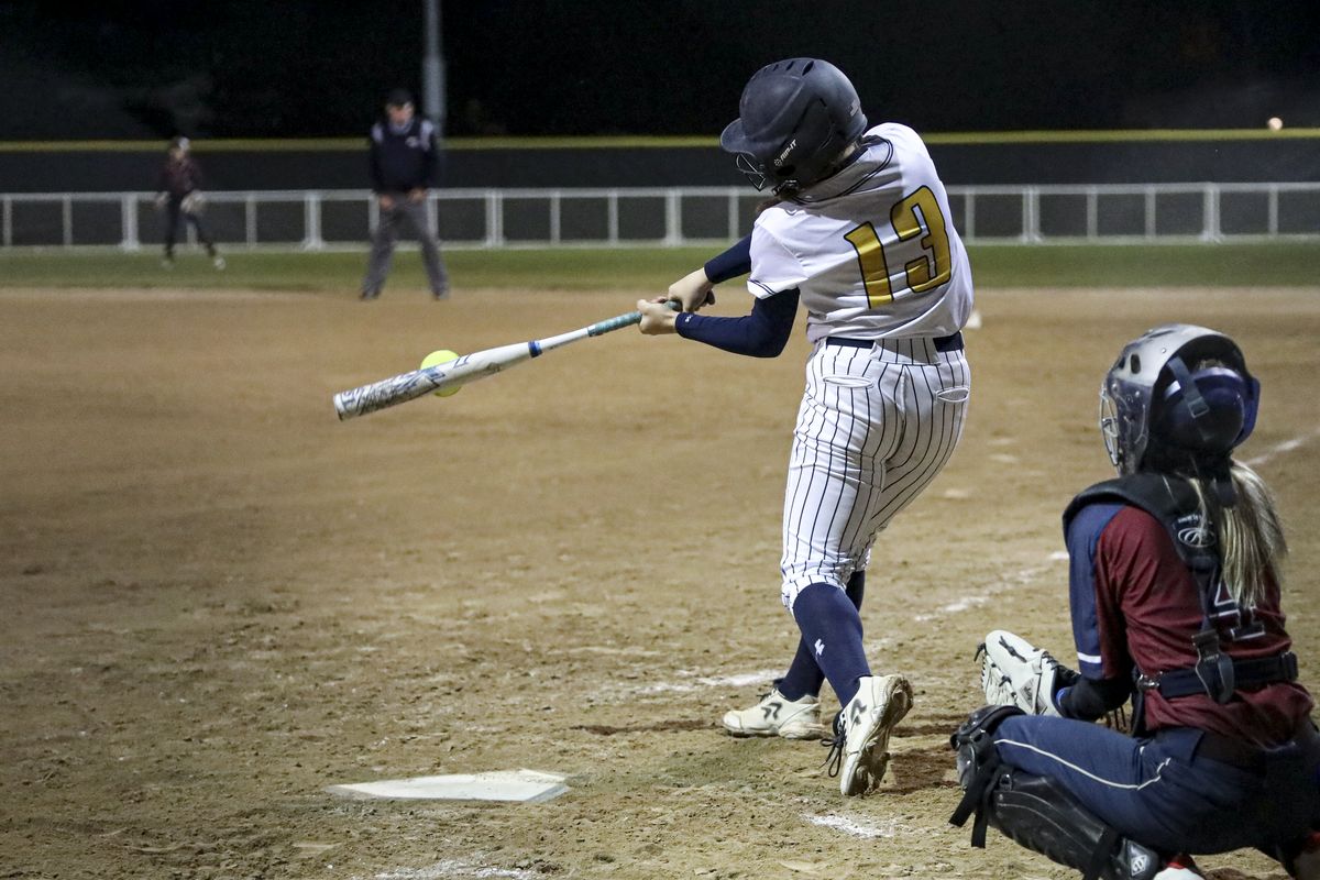 Mead outfielder Campbell Brose laces a base hit against Mt. Spokane on Monday, Oct. 18, 2021. The Panthers won 15-5 to force a three-way tie with the Wildcats and University atop the Greater Spokane League.  (CHERYL NICHOLS/For The Spokesman-Review)