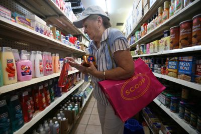 Cathy Tozzi shops at her local dollar store in New York. Tozzi, who lives in Brooklyn has cut back. “I shop at the 99-cent stores. There are ways of saving money.” Even so, she worries about inflation “eating into my savings.” (Associated Press / The Spokesman-Review)