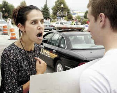 
President Bush supporter Temille Hoffert, of Washington, Iowa, argues with a John Kerry supporter outside LeClaire Park in Davenport, Iowa, on Wednesday. 
 (Associated Press / The Spokesman-Review)