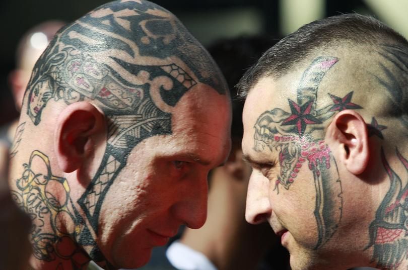 Participants show off their tattoos at the International London Tattoo Convention in this 2009 file photo. (Lefteris Pitarakis / Associated Press)