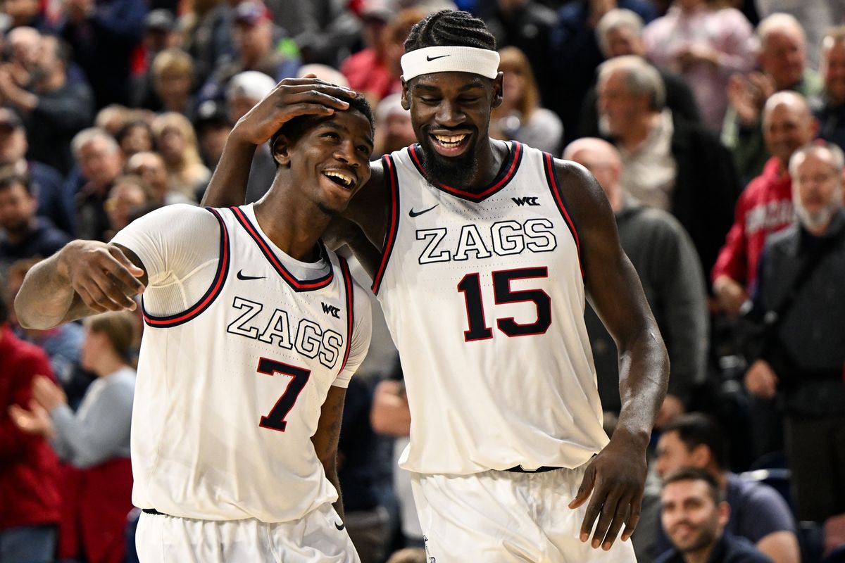 Gonzaga Bulldogs forward Graham Ike (15) puts his arm around teammate guard Tyon Grant-Foster (7) as they pull ahead to defeat the Seattle U Redhawks during overtime in a college basketball game on Friday, Jan 2, 2026, at McCarthey Athletic Center in Spokane, Wash. The Gonzaga Bulldogs won the game 80-72. (Tyler Tjomsland/The Spokesman-Review)