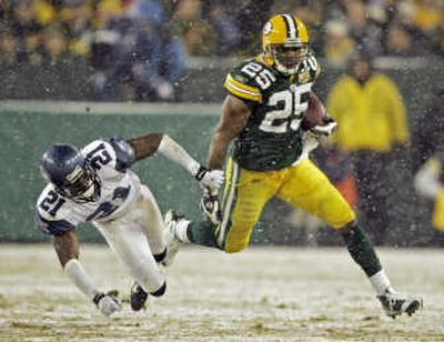 
Green Bay's Ryan Grant ran all over Kelly Jennings and the Seahawks Saturday, finishing with 201 rushing yards and three TDs. Associated Press
 (Associated Press / The Spokesman-Review)