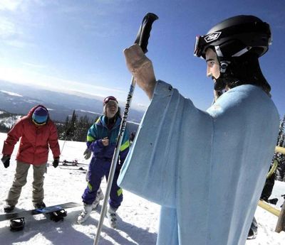 In this Feb. 20, 2011, file photo, University of Montana students visit a statue of Jesus Christ in Whitefish, Mont. (Linda Thompson / Associated Press)