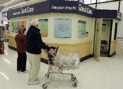 
Shoppers at a HyVee supermarket notice an Alegent Quick Care store located inside an Omaha, Neb., supermarket last month.
 (Associated Press / The Spokesman-Review)