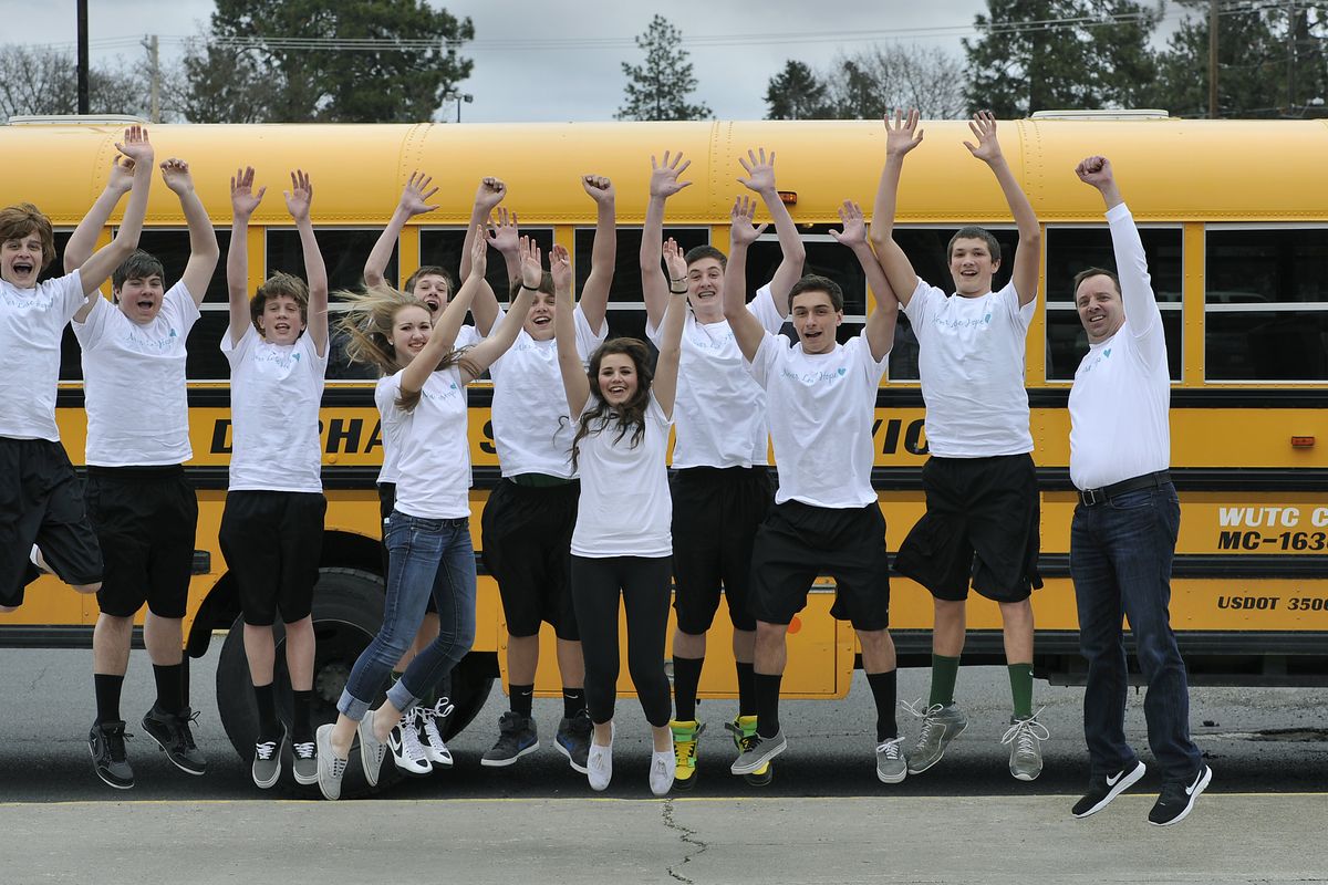 Members of the eighth-grade Salk Middle School basketball team, along with coach Kevin Selland, right, wear their T-shirts honoring Pat Fiorillo, a popular Sacajawea Middle School teacher.  The team played Sac on March 27 and wore the shirts, that read "Never Lose Hope" during warmups. Fiorillo's daughter, Gina, a Salk student, is fifth from right. (Dan Pelle / The Spokesman-Review)