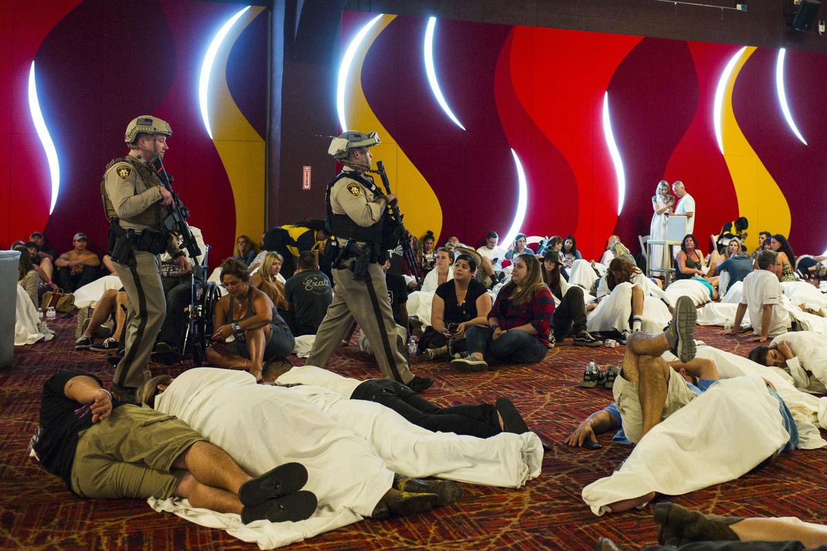Las Vegas police sweep through a convention center area during a lockdown Monday, Oct. 2, 2017, at the Tropicana Las Vegas following an active shooter situation on the Las Vegas Strip. (Chase Stevens / Associated Press)
