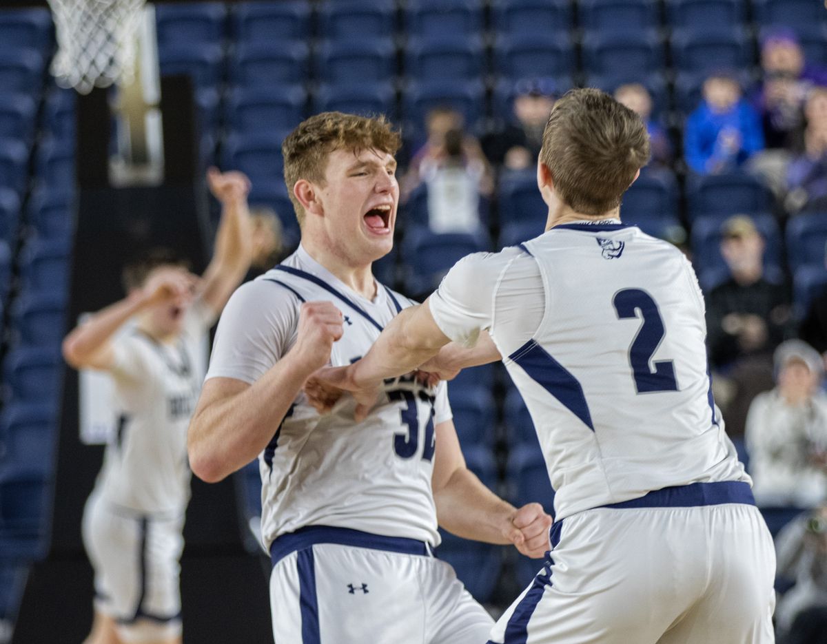 Gonzaga Prep’s Dylynn Groves, left, and Ryan Carney celebrate at the buzzer after their Class 4A state boys basketball game against Puyallup on Thursday at the Tacoma Dome.  (Patrick Hagerty/For The Spokesman-Review)