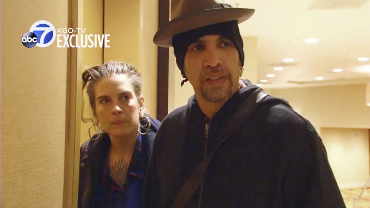 FILE - This file photo from exclusive video provided by San Francisco TV station KGO-TV, made late Sunday, Dec. 4, 2016, shows Derick Ion Almena, right, and Micah Allison, the couple who operated the Ghost Ship warehouse where dozens died in a fire, at an Oakland, Calif., courthouse. Almena, facing a second trial after a 2016 fire killed 36 partygoers at a San Francisco Bay Area warehouse he
