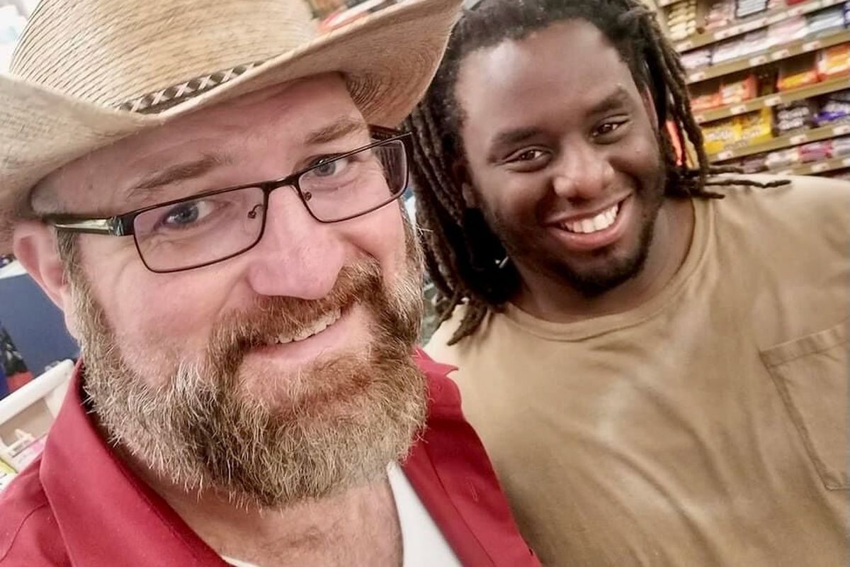 Jason James Boudreaux, left, with Kevin Jones at a grocery store in St. Martinville, La., on Feb. 24, 2023. Jones paid for Boudreaux
