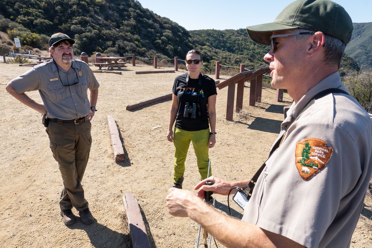 UCLA researcher Rachel Blakey, center, is flanked by Seth Riley, left, and Jeff Sikich, both with the National Park Service on Tuesday, Oct. 18, 2022 in Calabasas, California.    (Myung J. Chun/Los Angeles Times/TNS)