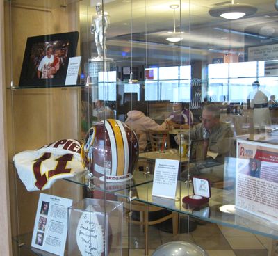 Hungry travelers enjoy lunch in the new MVP Home Turf Sports Bar and Grill at Spokane International Airport. The new restaurant features memorabilia of local sports icons, including a display to honor Super Bowl MVP Mark Rypien.  (Lisa Leinberger / The Spokesman-Review)