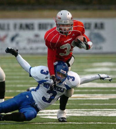 
A falling Kurt Stottlemyer  trips up Ferris' McKenzie Murphy. 
 (Jesse Tinsley / The Spokesman-Review)