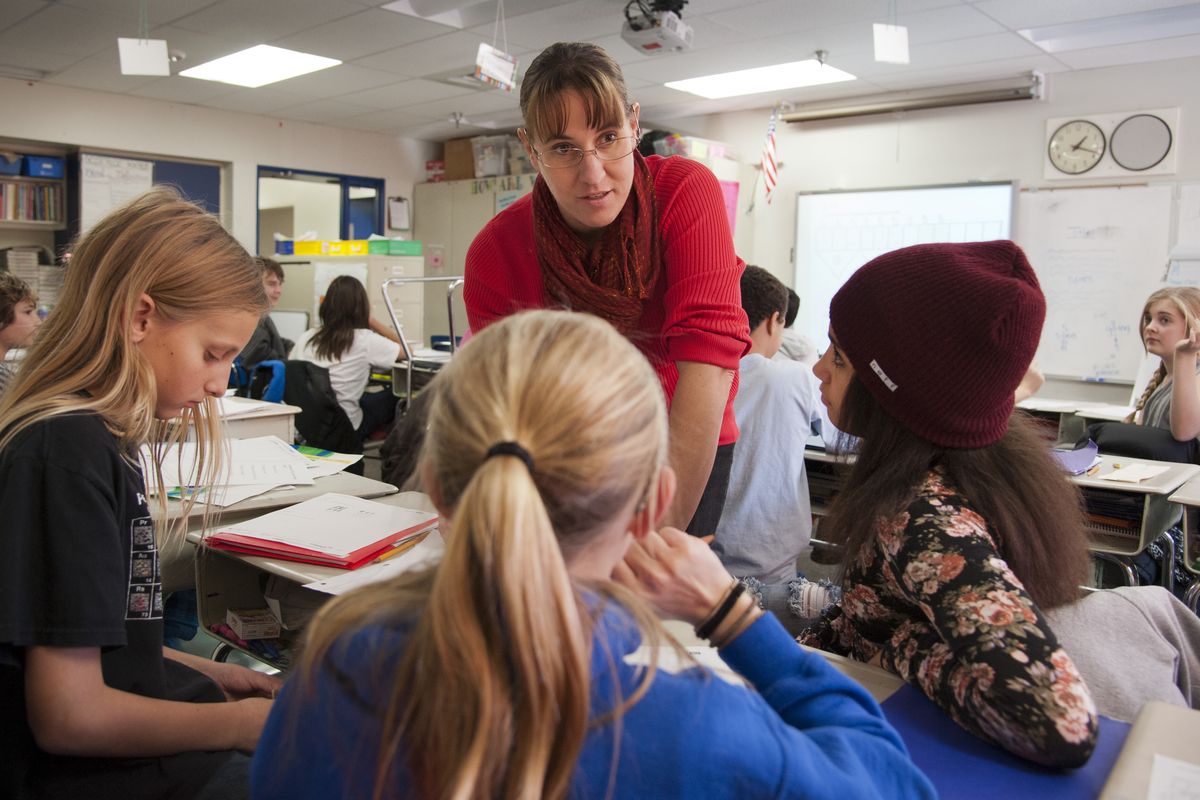 Roosevelt Elementary School sixth-grade teacher Tina Carson works with her students using new math program EngageNY. (Dan Pelle)
