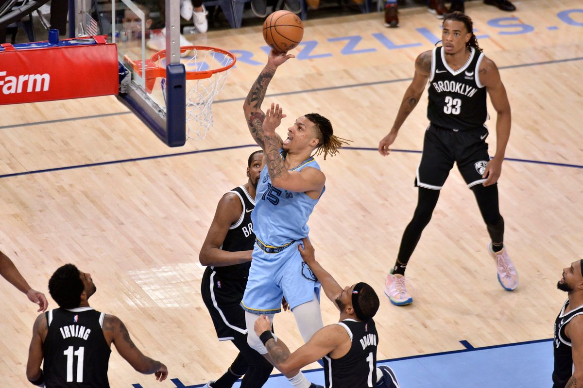 Memphis forward Brandon Clarke (15) elevates inside for a shot against Brooklyn in a March 23rd game.  (Associated Press)