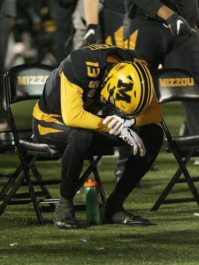 Missouri wide receiver Kam Scott sits alone on the bench in the final seconds of their 24-20 loss to Tennessee on Saturday in Columbia, Mo. (L.G. Patterson / Associated Press)