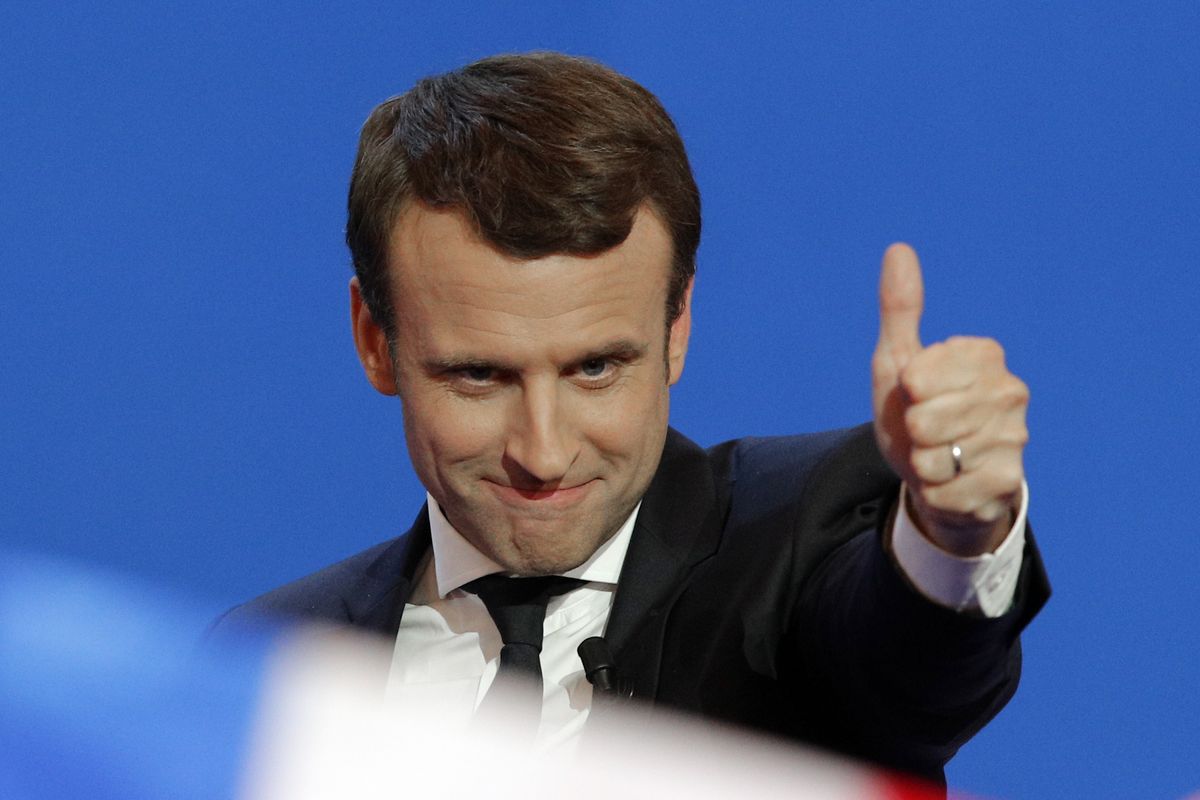 French centrist presidential candidate Emmanuel Macron thumbs up as he addresses his supporters at his election day headquarters in Paris, April 23, 2017. French President Emmanuel Macron hasn