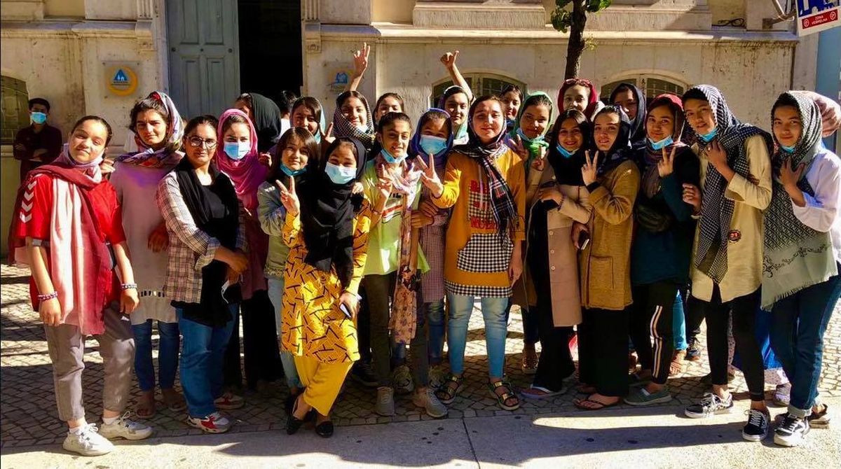 In this photo provided to The Associated Press, members of the Afghanistan national girls soccer team are seen on Tuesday, Sept. 21, 2021, in Lisbon, Portugal. Late Sunday night, almost three weeks after the American withdrawal from Afghanistan, the girls and their families landed in Lisbon after an international coalition came to their rescue.  (HONS)