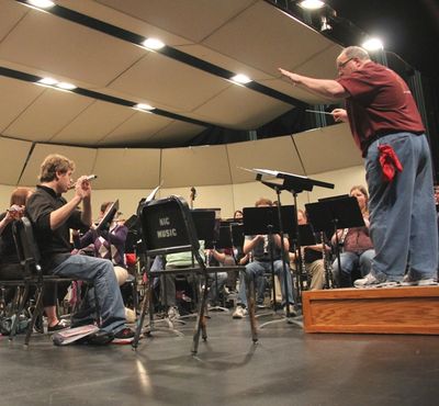 Longtime NIC Band Director Terry Jones conducts an NIC orchestra during a past rehearsal. On May 2, Jones will be honored for his years of service at “A Swingin’ Farewell” (Tom Green/NIC Press Room photo)
