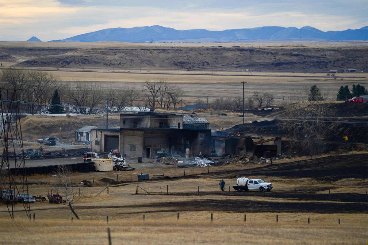 A fire burned through the Gibson Flats area south of Great Falls, Mont., on Wednesday, Dec. 1, 2021, destroying 11 homes, seven garages and 11 outbuildings, fire officials said. The fire was one of three wind-driven fires on Wednesday that forced evacuations in Montana. A fire near Denton led hundreds of residents to flee the central Montana town on Wednesday. Some buildings in the town were on fire. Another grass fire forced temporary evacuations near Browning, east of Glacier National Park.  (Rion Sanders)