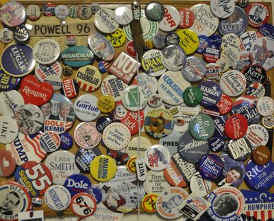 Campaign buttons and paraphernalia, some dating back more than 70 years, from a display on the wall in The Spokesman-Review's Olympia office. (Jim Camden/The Spokesman-Review)