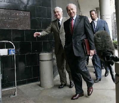 
Enron founder Kenneth Lay, center, arrives at the federal courthouse with his attorney Mike Ramsey, left, for a pre-trial hearing in his case Thursday. 
 (Associated Press / The Spokesman-Review)