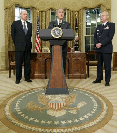 
President Bush announces in the Oval Office on Monday  that Air Force Gen. Michael Hayden, right, is his choice for CIA director.  At left is National Intelligence Director John Negroponte. 
 (Associated Press / The Spokesman-Review)