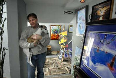 
Painter and graphic artist James Mulvania is shown at his Deer Park home with his dog Zizzy. 
 (Dan Pelle / The Spokesman-Review)