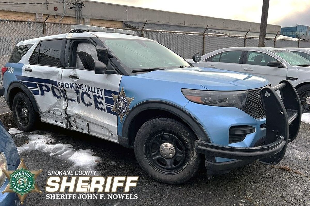 A Spokane Valley police car was damaged Wednesday night after a suspected drunken driver slammed into it while it was blocking Broadway Avenue for a separate crash investigation. (Courtesy of Spokane County Sheriff