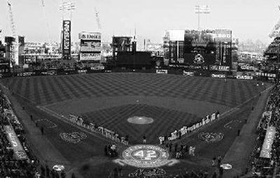 
The Braves and Mets take part in a Jackie Robinson pregame ceremony.  
 (Associated Press / The Spokesman-Review)