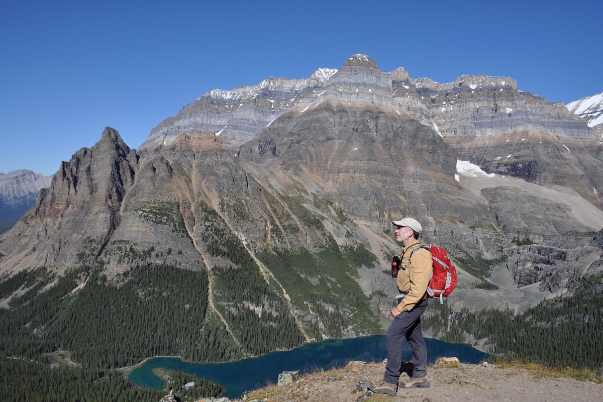 Rich Landers carries essential items in his day pack while hiking, with his bear spray handy outside the pack on his sternum strap. (MEREDITH HEICK / Meredith Heick photo)