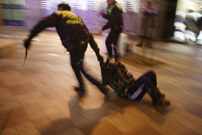 Police drag away a demonstrator during street disturbances in Madrid on Wednesday.  Protesters in Spain attacked banks, shops and a police station.  (Associated Press / The Spokesman-Review)