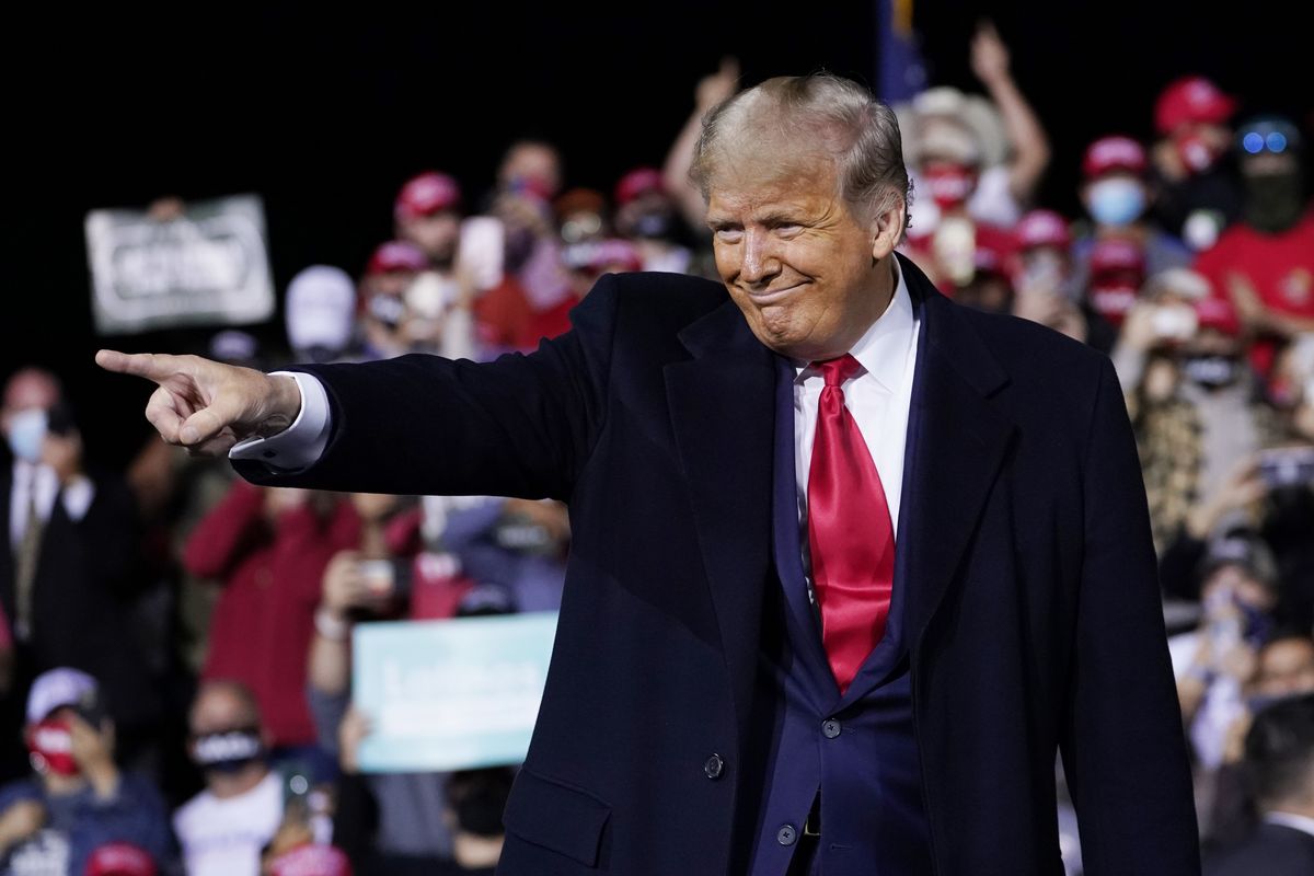 President Donald Trump wraps up his speech at a campaign rally Saturday at Fayetteville Regional Airport in Fayetteville, N.C.  (Associated Press)