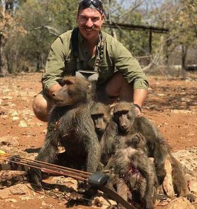 Blake Fischer of Meridian, an Idaho Fish and Game commissioner, poses with the baboons he shot with a recurve bow in Namibia. (Courtesy Idaho Statesman (via Idaho governor's office))