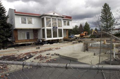 This office building at the corner of Trent and Argonne owned by Phoenix Development has been jacked up and is waiting for the proper permits so it can be moved to 7721 E. Trent Ave. Red Horse Construction is the mover. A new Walgreens is slated to be built at that location.
(J. BART RAYNIAK photos / The Spokesman-Review)