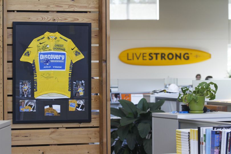 An autographed cycling jersey hangs in the offces of Livestrong, Lance Armstrong's cancer-fighting charity, Wednesday, Oct. 17, 2012, in Austin, Texas. Armstrong stepped down as chairman of Livestrong on Wednesday. (Jack Plunkett / Fr59553 Ap)