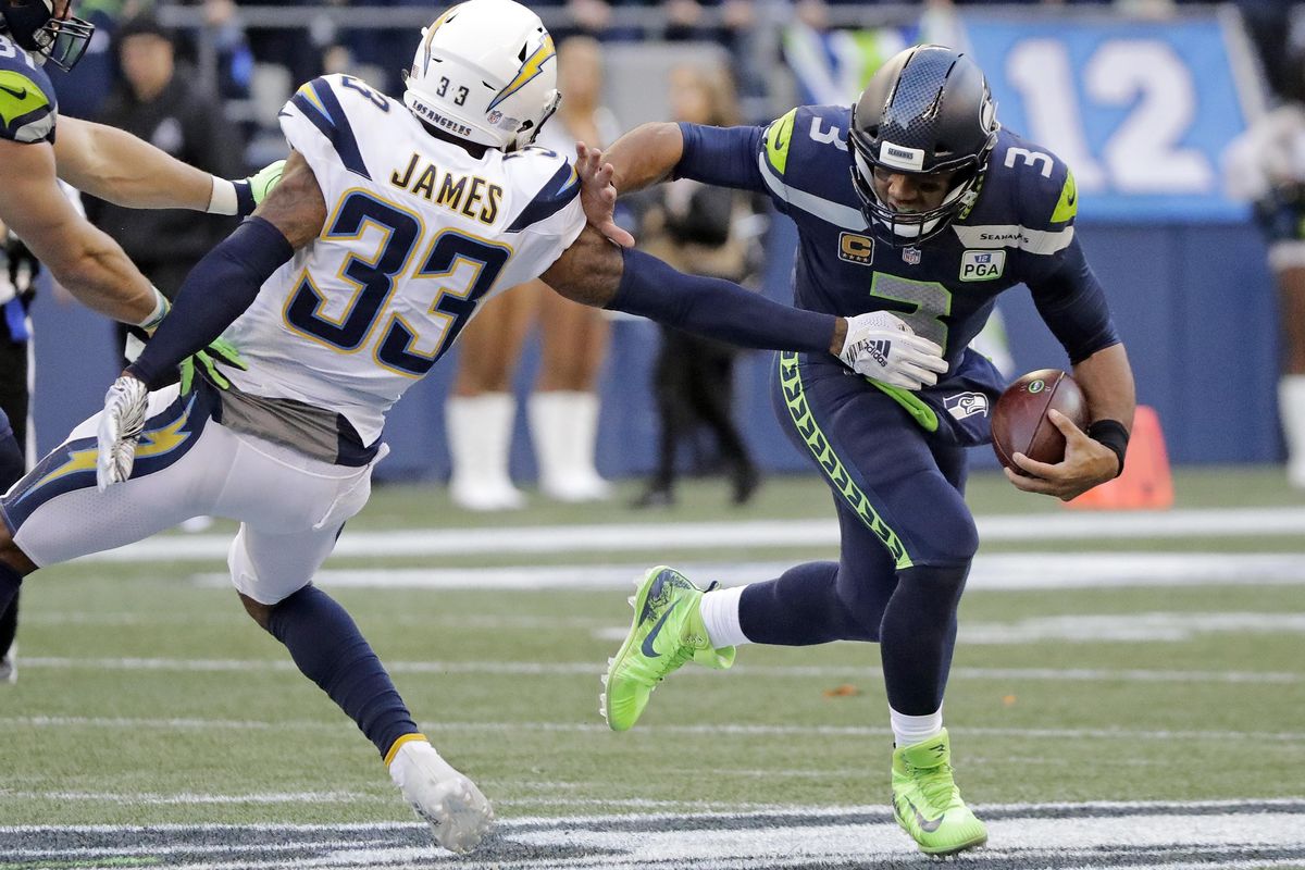 Seattle Seahawks quarterback Russell Wilson (3) scrambles away from Los Angeles Chargers