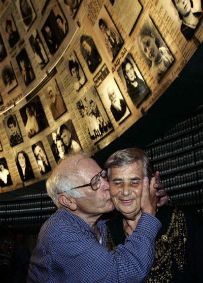 
Simon Glasberg, 81, of Ottawa, Canada, left, kisses his sister Hilda Shlick, 75, from Ashdod, Israel, during their meeting Monday at the Yad Vashem Holocaust museum in Jerusalem. 
 (Associated Press / The Spokesman-Review)