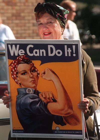 Geraldine Hoff Doyle holds a copy of the World War II “Rosie the Riveter” poster made with her likeness.  (Associated Press)